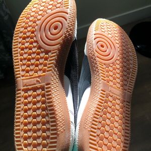 White Pumas with Black Stripe